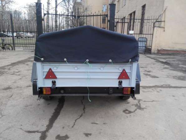Прицеп для легкового автомобиля с V образным дышлом 1800х1250 с тентом и дугами в Москве фото 12