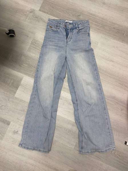 Джинсы клеш